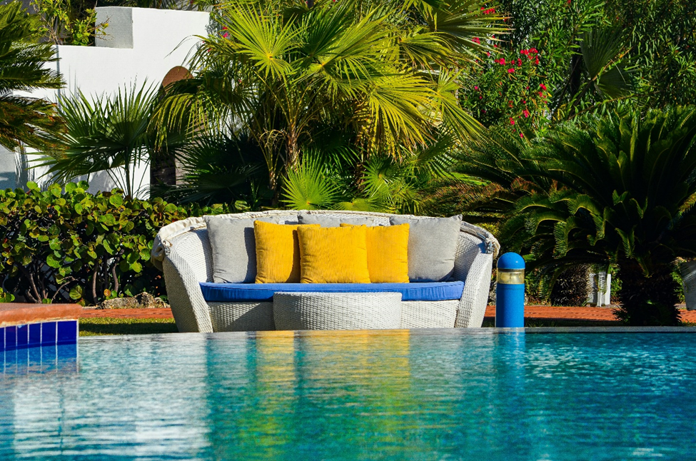 Sofa by the pool side to be enjoyed by the Anguilla digital nomad visa holder.